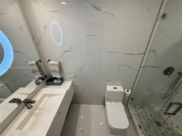 bathroom featuring vanity, tile walls, toilet, and a shower with door