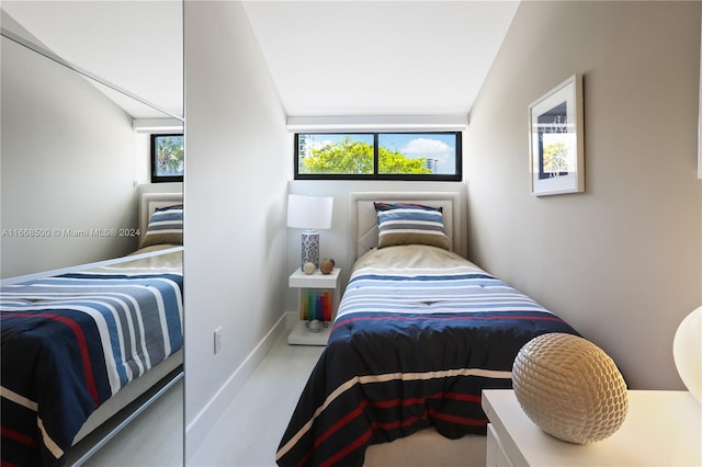 bedroom featuring vaulted ceiling