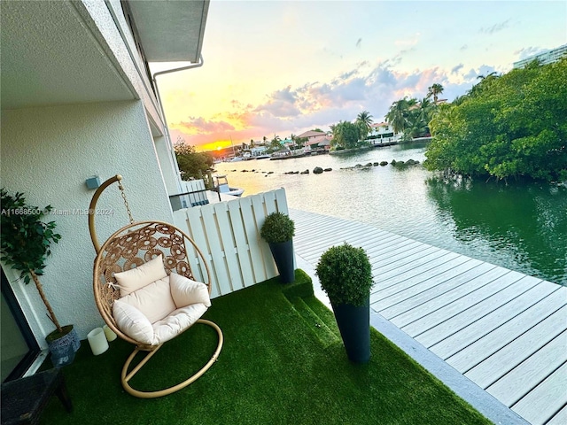 balcony at dusk with a water view