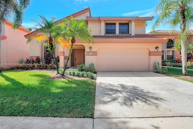 mediterranean / spanish-style house with a garage and a front lawn