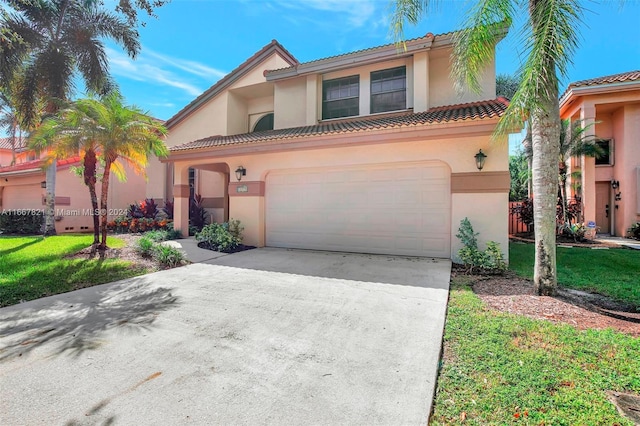 mediterranean / spanish-style home with a garage and a front lawn