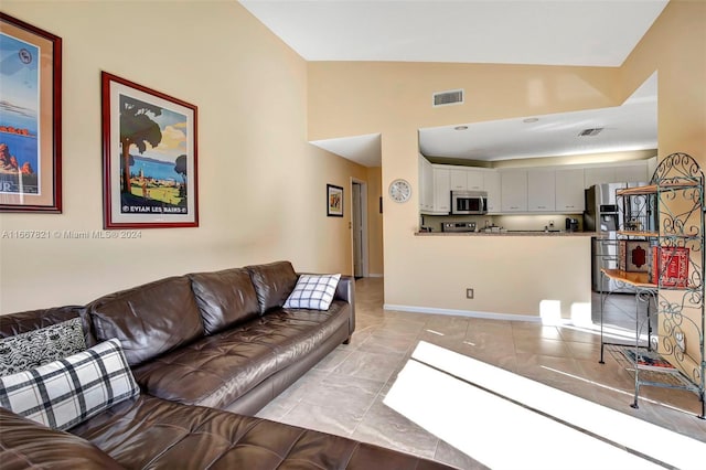 tiled living room with vaulted ceiling