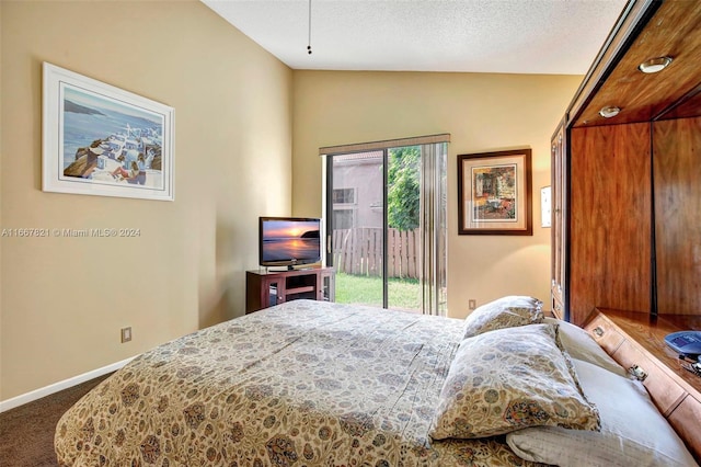 bedroom with access to outside, carpet flooring, a textured ceiling, and vaulted ceiling