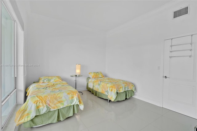 bedroom featuring tile patterned flooring