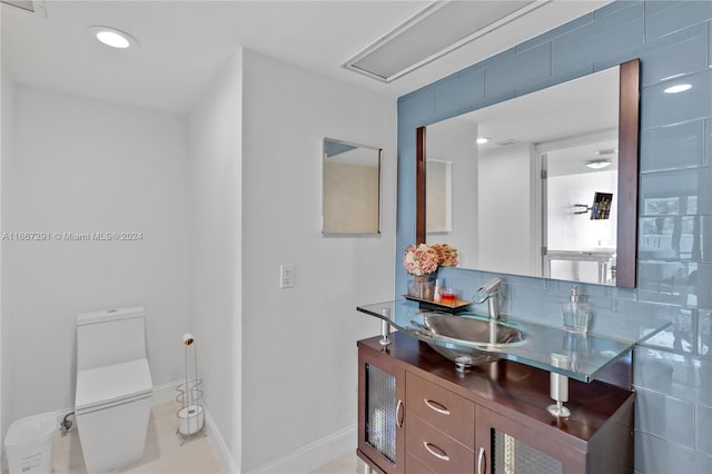 bathroom featuring vanity and toilet