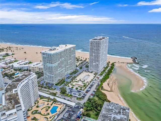 aerial view featuring a view of the beach and a water view