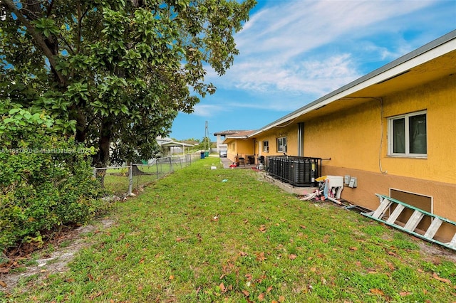 view of yard with central AC unit