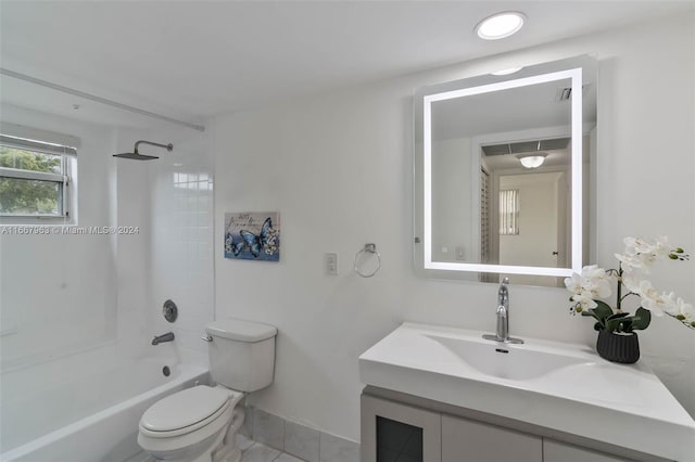 full bathroom with vanity, toilet, and tiled shower / bath