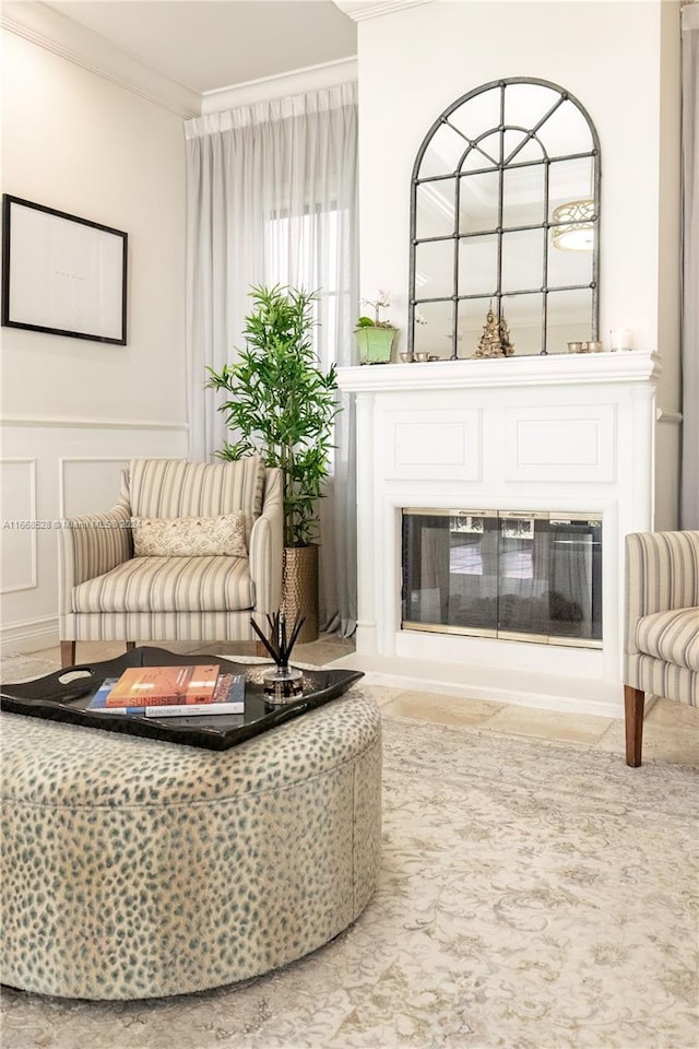 sitting room featuring ornamental molding