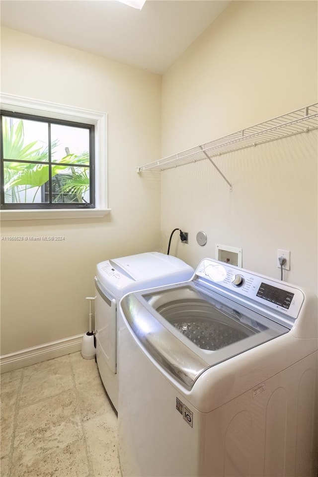 washroom with washer and dryer