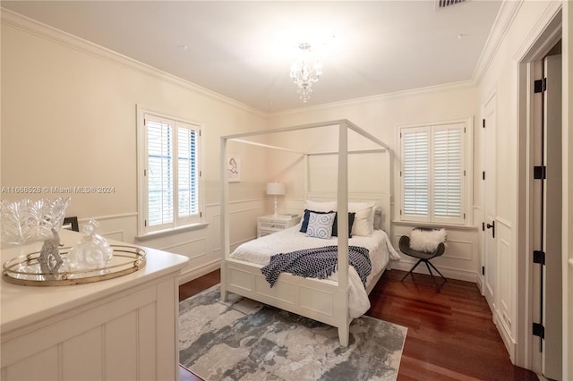 bedroom with ornamental molding and hardwood / wood-style floors