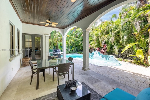 view of patio with area for grilling, ceiling fan, and french doors