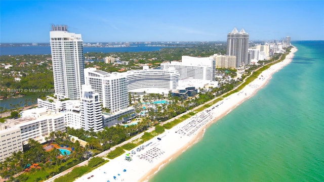 birds eye view of property featuring a view of the beach and a water view