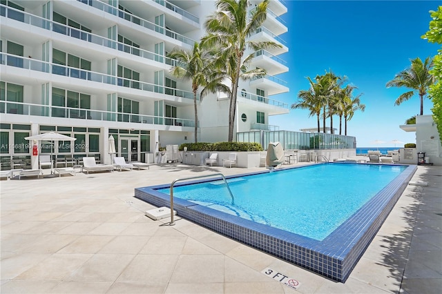 view of swimming pool with a patio area