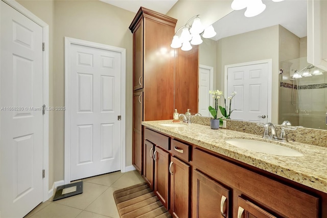 bathroom with tile patterned floors, vanity, and walk in shower