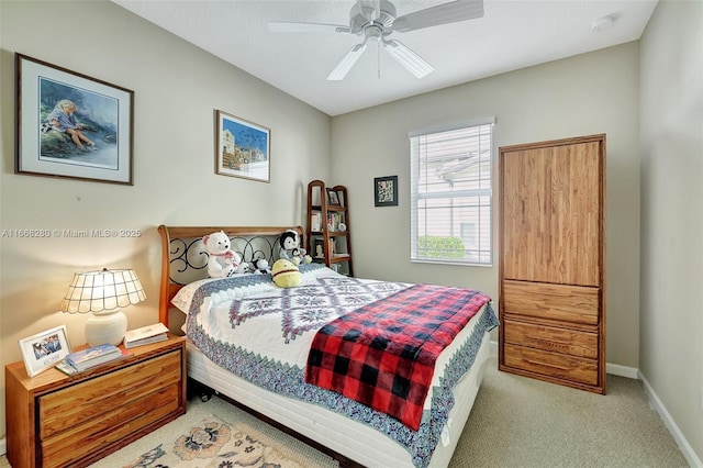 bedroom featuring ceiling fan and light carpet