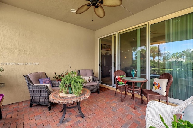 view of patio with ceiling fan