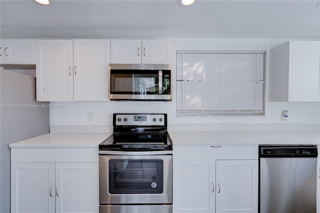 kitchen with white cabinetry and stainless steel appliances