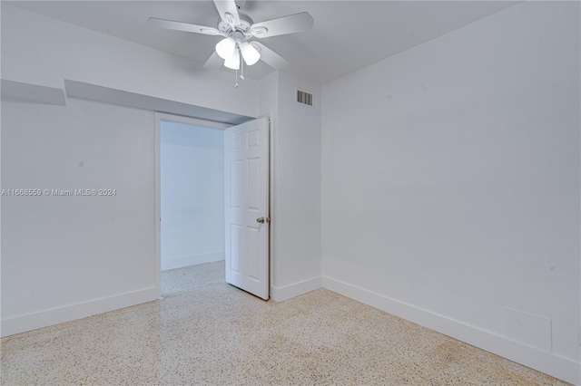 spare room with ceiling fan