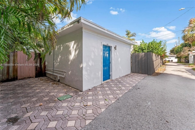 view of side of home with a patio area