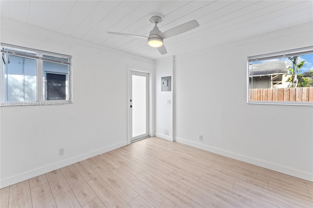 unfurnished room featuring ceiling fan, light hardwood / wood-style floors, wooden ceiling, and ornamental molding