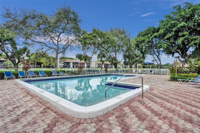 view of pool featuring a patio area