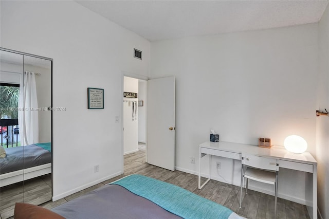 bedroom with wood-type flooring