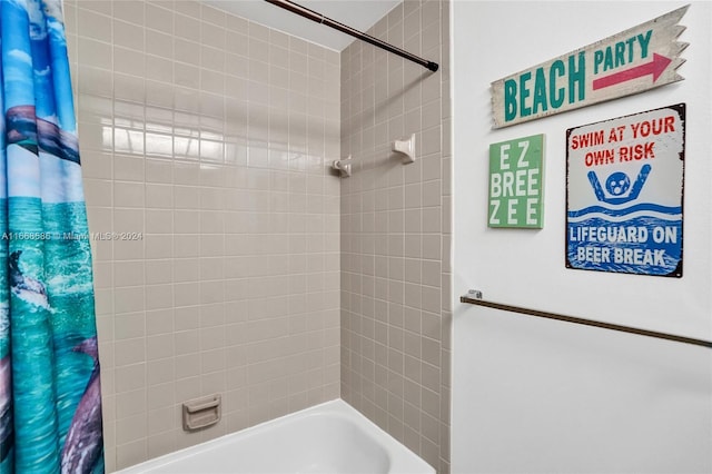 bathroom featuring shower / bath combination with curtain