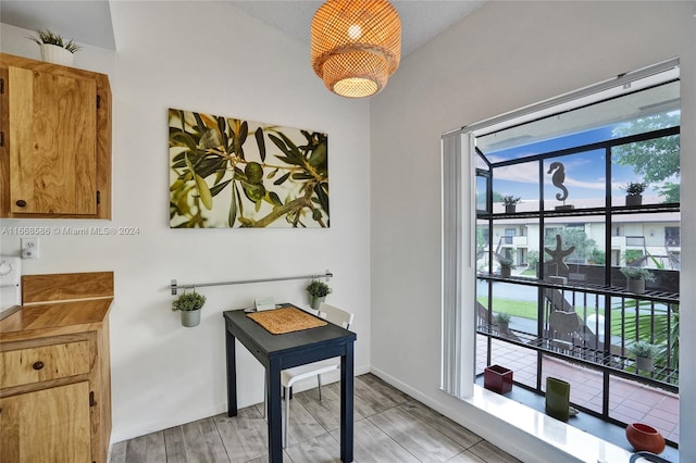 office with light hardwood / wood-style flooring