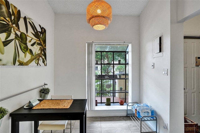 interior space featuring a textured ceiling and tile patterned floors