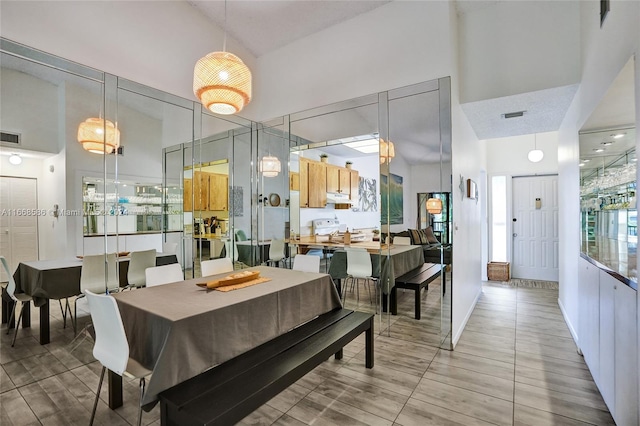 dining room with a high ceiling