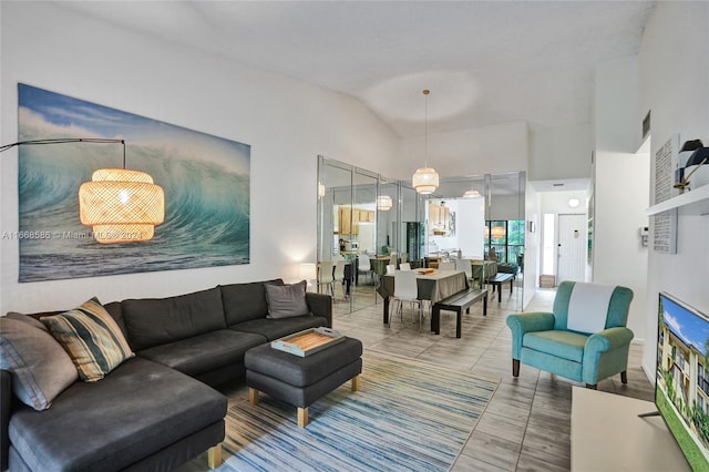 living room featuring lofted ceiling