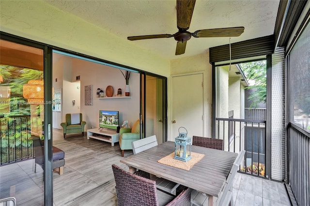 sunroom / solarium with ceiling fan