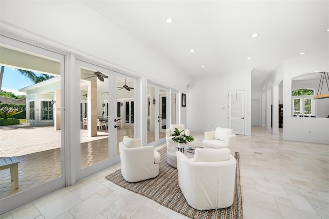 living room featuring french doors and ornamental molding