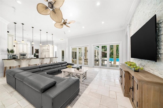 living room featuring french doors, ceiling fan, and crown molding