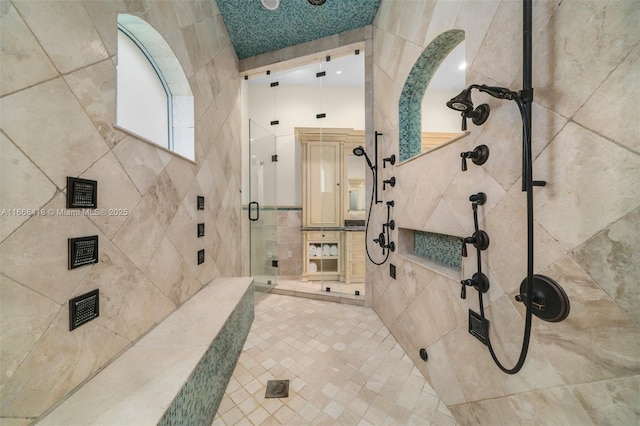 7860 SW 129th Ter, Pinecrest, FL 33156 - full bathroom with a stall shower and tile walls