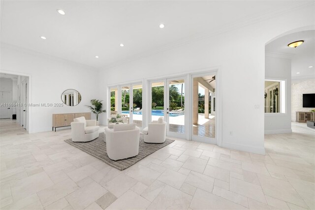 7860 SW 129th Ter, Pinecrest, FL 33156 - living room featuring crown molding, recessed lighting, french doors, arched walkways, and baseboards