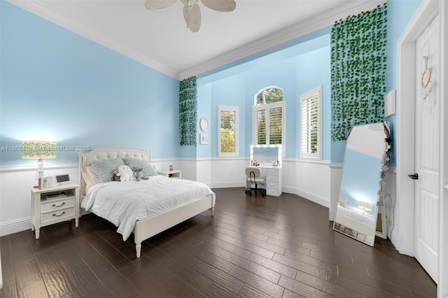 bedroom with crown molding, ceiling fan, and dark wood-type flooring