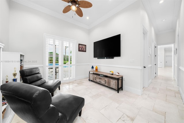 living room with ceiling fan and crown molding