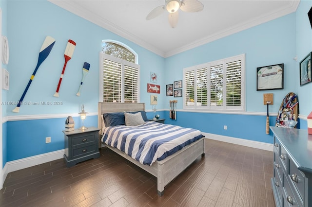 bedroom with multiple windows, ceiling fan, dark hardwood / wood-style floors, and ornamental molding