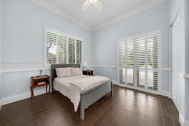 bedroom featuring crown molding, ceiling fan, and dark wood-type flooring