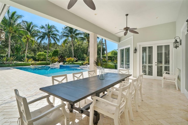 view of swimming pool featuring ceiling fan, french doors, a patio, and a hot tub