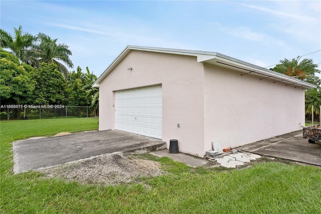 garage with a lawn