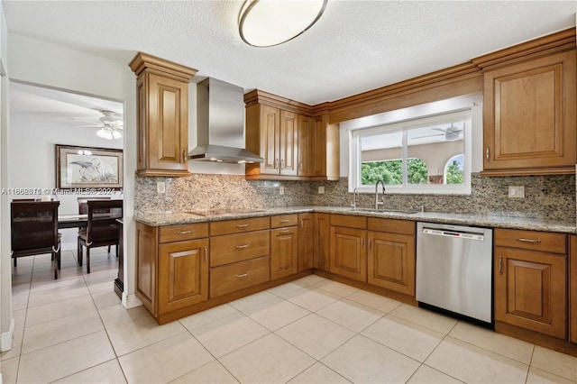 kitchen with dishwasher, a textured ceiling, sink, wall chimney exhaust hood, and light stone countertops