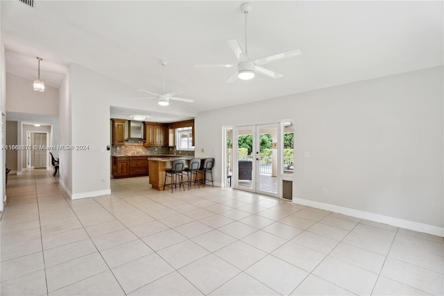 living room with light tile patterned flooring and ceiling fan