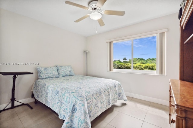 tiled bedroom with ceiling fan