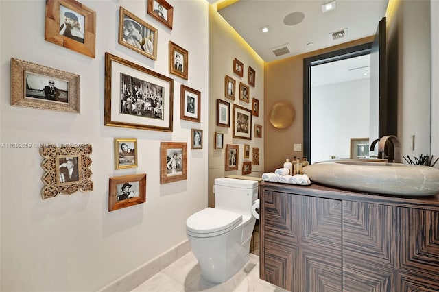 bathroom featuring sink and toilet