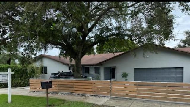 single story home featuring a garage