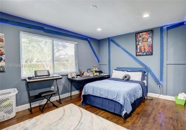 bedroom with dark hardwood / wood-style flooring