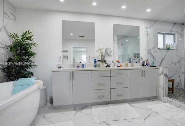 bathroom featuring vanity and independent shower and bath